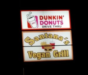 the sign from the road at night Santana's Vegan Grill at Santana's Vegan Grill in Colorado Springs