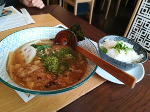 tan tan ramen soup with pulled jackfruit (last one from the vegetarian ramen section of the menu) + rice instead of ramen at Umaii Ramenbar in Leipzig