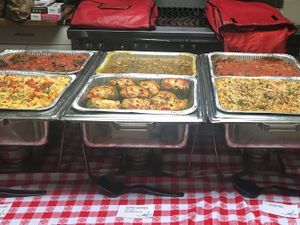 Offsite Vegan Catering. First row from left to right: Penne Ala Vodka, Stuffed Peppers, Baked Mac. Second Row: Mushroom Meatballs, Potato Mushroom Curry, Baked Eggplant at Pizza Mia in New Windsor