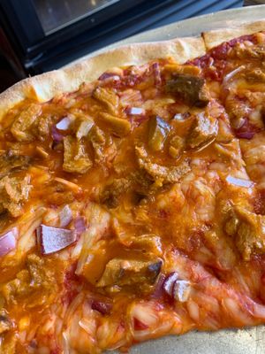 Buffalo seitan with red onions at Pizza Mia in New Windsor