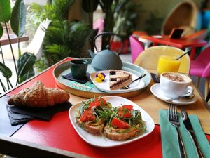 Brunch with croissant, cake advocado toast, cappuccino, tea and champagne at Floripa in Barcelona