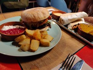 American burger, in the background El Gringo burrito. at Floripa in Barcelona