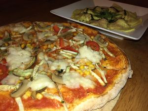 So much vegan mozzarella on our pizza mmm at Green-Go Garden in Siem Reap