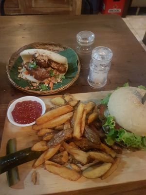 Veggie burger with lentil patty and tofu bao bun at Small Time Cooks in Abang