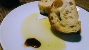 Bread baskets arrive upon arrival, check which ones are vegan and send back the butter. But the olive oil and balsamic is gorgeous as a dipping.  at Doppio Zero - Pineslopes in Johannesburg