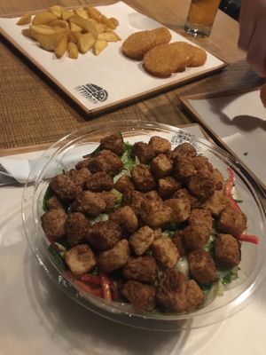 Crispy tofu salad with fries and potato rosti! Super tasty :) at Attaboy in Budapest