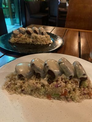 Falafels with cheese sauce on couscous  at Bio & Natural - Quinta Avenida in Playa Del Carmen