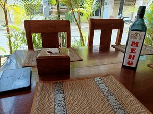 Menu on a bottle at Coconut Lyly in Battambang