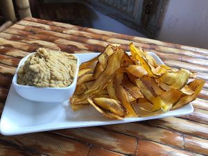 Plantain chips + Hummus at California Cafe  in Havana