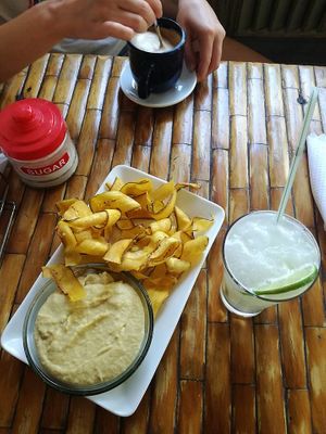 Hummus served with plantain chips and limonada frappe at California Cafe  in Havana