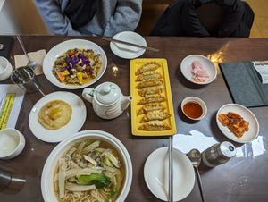 Clockwise from top left: vegan sweet and sour pork, dumplings, pink radish, kimchi, mushroom soup, vegan fried egg. at Oh Se Gae Hyang - 오세계향 in Seoul