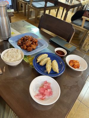 Sweet & spicy chicken with rice, veggie dumplings, radish kimchi, and pickled radish   at Oh Se Gae Hyang - 오세계향 in Seoul