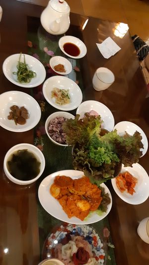 Table full of side dishes and Korean bbq at Oh Se Gae Hyang - 오세계향 in Seoul