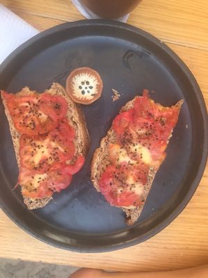 Tomato toast with hummus, sooo good! at Hierba Dulce in Oaxaca