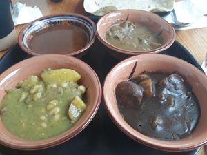 4 of the 7 moles (rojo, chichilo, verde & enstofado verde) at Hierba Dulce in Oaxaca