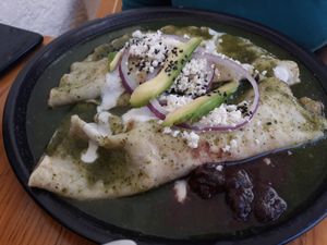 Enchiladas de hierba santa with almonds' vegan cream & cheese! at Hierba Dulce in Oaxaca