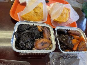 Very good food!! Ordered very spicy jerk chicken(bottom plate), oxtail (top plate), and beef patties.  at Caribreeze in Spring Valley