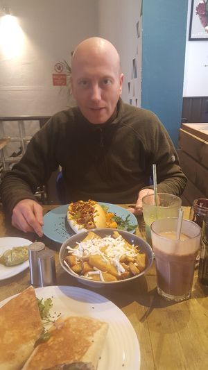 A hungry and happy boy. X at Seeds for the Soul in Edinburgh