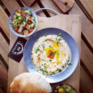 vegan hummus plate (includes pita and pickles) with israeli salad at Medani Bakery in Bondi Junction