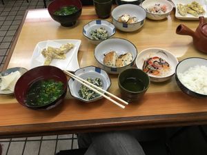 Sweet potato tempura, clear soup with wakame and some veggies. Spinach with chestnut, tofu mixed with mushrooms and carrots, glass noodles and rice at Tsujigahana in Matsuyama