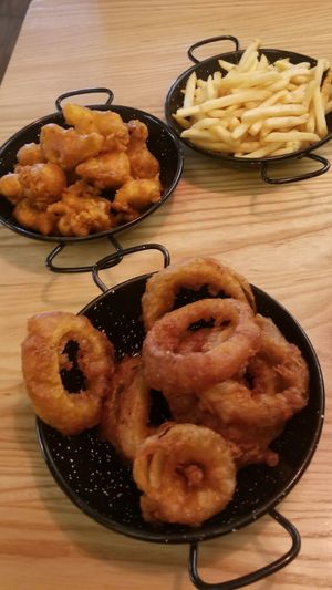 Spiced popcorn cauliflower, fries & onion rings ~ all very good. at Culture Burger Joint in Nelson
