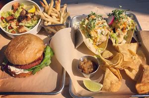 Cauliflower tacos, beyond burger, truffle fries, Cesar salad at Second Nature in San Diego