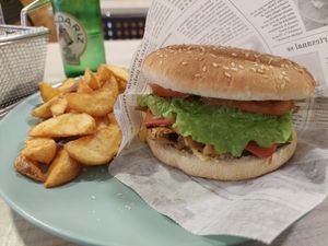 No-pollo burger (heura pb chickn sandwich) and potato wedgess at Veggie Burger in Vigo