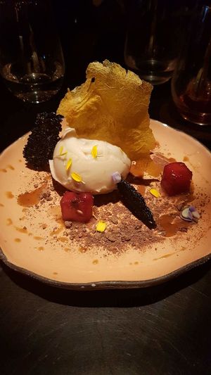 Guanabana pannacotta with vodka watermelon and black sesame seed brittle at Justo Restaurant in Medellin