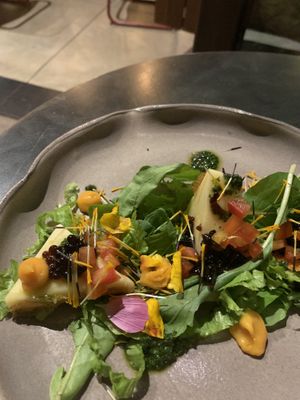 Caprese salad with vegan cheese at Justo Restaurant in Medellin