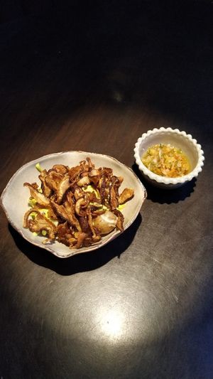 Brotes de la tierra, papas con salsa de queso de almendra y shitaque at Justo Restaurant in Medellin