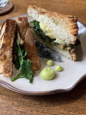 Desayuno (breakfast) panini - sanduche with almond ‘cheese’ mushrooms and spinach  at Justo Restaurant in Medellin