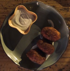 Las Carimanolas: una rellena de shitake, orellanas, y queso at Justo Restaurant in Medellin