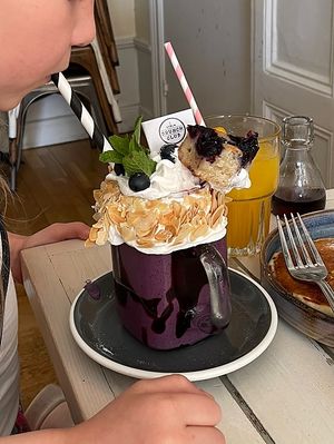 Blueberry milkshake has a piece of blueberry cake😄 at STHLM Brunch Club in Stockholm
