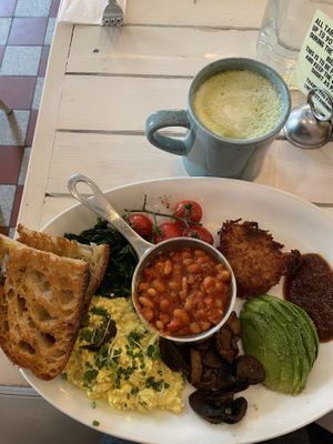 Full vegan English breakfast and oatmilk matcha latte  at STHLM Brunch Club in Stockholm
