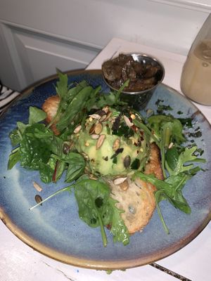 Avocado on toast with an extra side of mushrooms  at STHLM Brunch Club in Stockholm