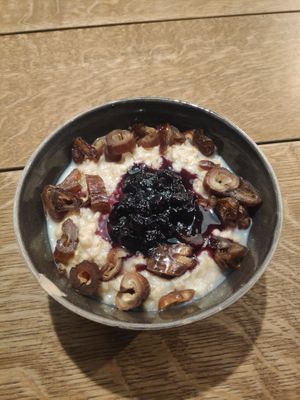 Oat porridge with milk, home made jam and dates at Bowl Market in Copenhagen