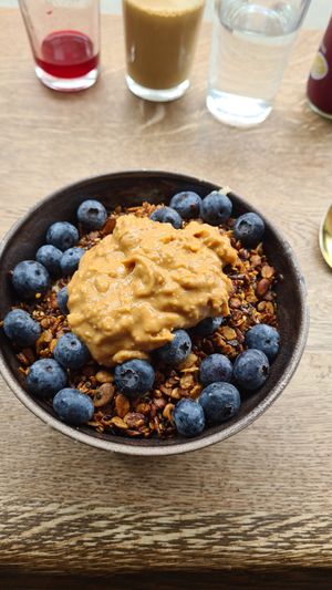 Porridge with blueberries Peanutbutter and Homemade Granola at Bowl Market in Copenhagen