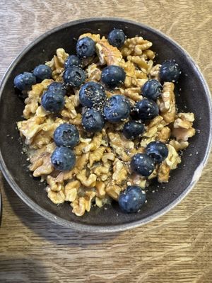 Massive bowl of oats with walnuts, chia, blueberries   at Bowl Market in Copenhagen