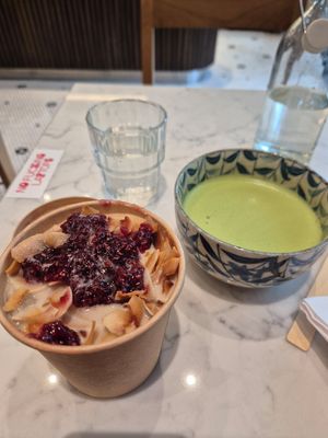 Coconut and raspberry porridge. Added some oat milk and was super delicious. (I'm sitting at another café in this pic) at Bowl Market in Copenhagen