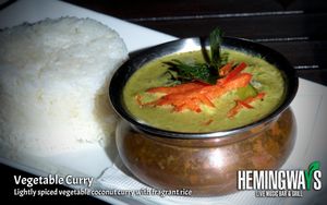Vegetable Curry                            100% Vegan
A lightly spiced vegetable coconut curry at Hemingway's By The Bay in Outlying Islands