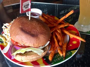 Beyond meat burger with sweet potato fries at Hemingway's By The Bay in Outlying Islands