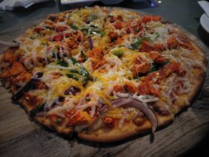 Tandoori chick'n pizza  at Hemingway's By The Bay in Outlying Islands