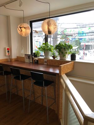 They have a cozy atmosphere and nice view of the street outside at Veggie House in Chiba