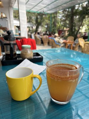 Cozy setting and Apple and cinnamon infusion  at Ira's Kitchen & Tea Room in Rishikesh