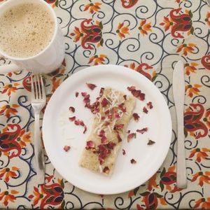 Coconut dessert with chai tea at Ira's Kitchen & Tea Room in Rishikesh