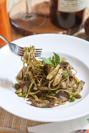 Pesto Spaghetti with Perilla Seed

Quantitatively delicious (for 1 pax): Energy 660 kcal | Fat 44 g (Saturated Fat 6 g, Cholesterol 0 g) | Carbohydrate 56 g (Fibre 6 g, Sugar 3 g) | Protein 14 g | Sodium 106 mg

Qualitatively enjoyable: The cheesy and nutty taste of our cheese-free pesto sauce is derived from Thai perilla seeds and cashew nuts. Perilla seeds are a good source of alpha-linolenic acid (ALA), a kind of omega-3 fatty acid found in plants. Cashew nuts also contain heart-friendly components such as monounsaturated fats and phytosterols. This dish seems to be high in fat. In fact, the majority of the fatty components are plant-derived unsaturated fats that are good for health. Addtionally, this dish is low in sugar and sodium. The salty taste of our vegan pesto sauce is obtained from fleur de sel.

155 THB at Tonklar Facai - Siriraj in Bangkok