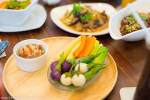 Spicy Amla Chilli Paste

Quantitatively delicious (for 2 pax): Energy 213 kcal | Fat 1 g (Saturated Fat 0 g, Cholesterol 0 g) | Carbohydrate 51 g (Fibre 8 g, Sugar 20 g) | Protein 6 g | Sodium 1,488 mg

Qualitatively enjoyable: Indian gooseberries, also known as amla, are an Ayuravedic longevity herb. These fruits taste sour and astringent because of their considerable amounts of vitamin C and polyphenols. Such tastes get along really well with the pungent taste of grilled chillies, shallots and garlic cloves. This dish is low in saturated fat. 

145 THB at Tonklar Facai - Siriraj in Bangkok