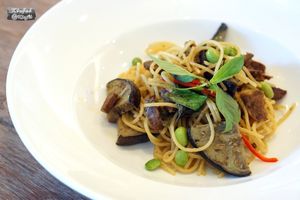 Spaghetti with Thai Green Curry with Grilled Aubergine

Quantitatively delicious (for 1 pax): Energy 459 kcal | Fat 19 g (Saturated Fat 14 g, Cholesterol 0 g) | Carbohydrate 61 g (Fibre 7 g, Sugar 10 g) | Protein 13 g | Sodium 576 mg

Qualitatively enjoyable: Our Spaghetti with Thai green curry are packed with the texture of mushroom stipes, the decent protein of edamame and the savour of grilled aubergine. The purple-skinned aubergine contains antioxidant anthocyanins that possesses anti-ageing properties.  This dish contains coconut-derived, saturated fats. However, the majority of them are medium-chain triglycerides (MCT) that can be easily absorbed and then utilised rapidly.

99 THB at Tonklar Facai - Siriraj in Bangkok