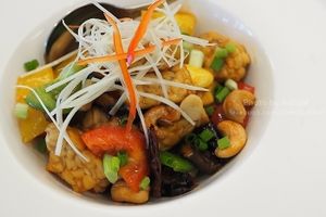 Stir-Fried Tempeh with Cashew Nuts

Quantitatively delicious (for 2 pax): Energy 453 kcal | Fat 29 g (Saturated Fat 5 g, Cholesterol 0 g) | Carbohydrate 31 g (Fibre 4 g, Sugar 8 g) | Protein 26 g | Sodium 473 mg

Qualitatively enjoyable: The pleasant texture of tempeh gets along really well with cashew nuts and chestnuts, which are considered to be a great source of cholesterol-controlling monounsaturated fat and phytosterol. Fried chillies and sweet peppers are just added to enhance the exquisite flavour of this stir-fry. Camellia seed oil is used for stir-frying, and this dish contains decent protein from tempeh and a moderate amount of sugar.

149 THB at Tonklar Facai - Siriraj in Bangkok