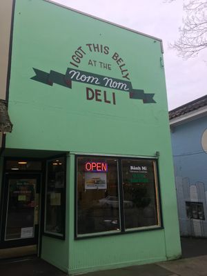 Facade of restaurant. “We serve Vegan Options” in the window. at Nom Nom Cafe in Olympia